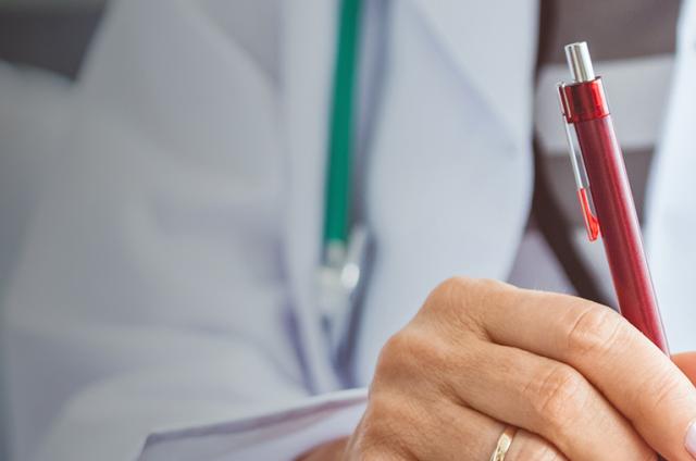 A doctor taking notes